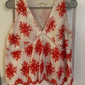 White and red pattern blouse. Deep v. Size M